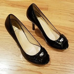Black patent leather Cole Haan pumps